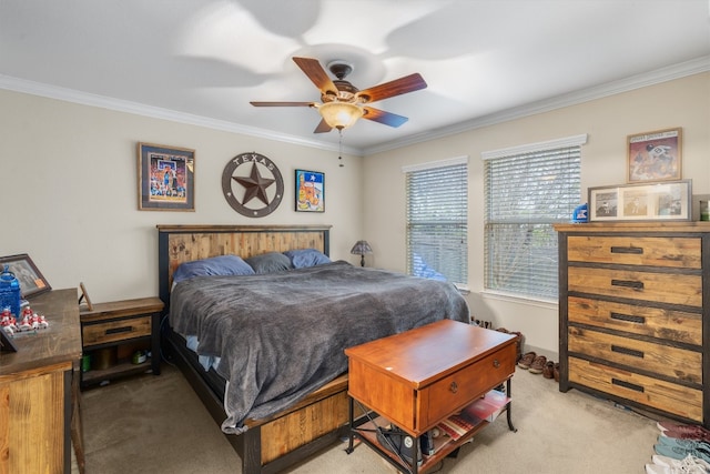 bedroom featuring ornamental molding, light carpet, and ceiling fan