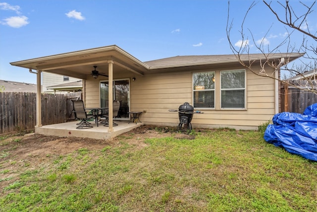 rear view of house with a yard, a patio area, and ceiling fan