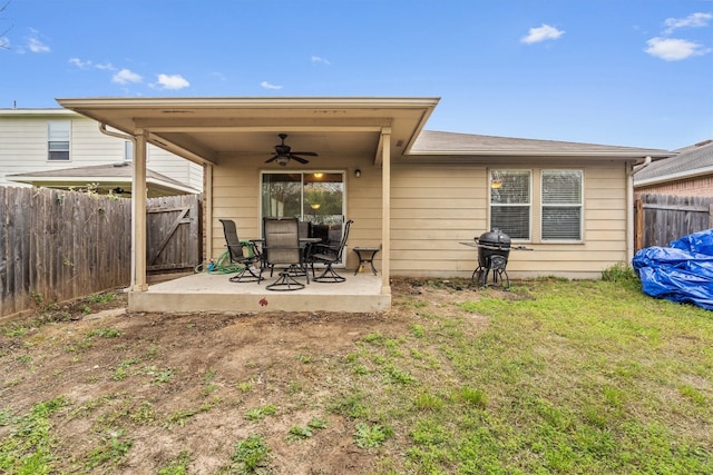 rear view of house featuring a patio area, a lawn, and ceiling fan