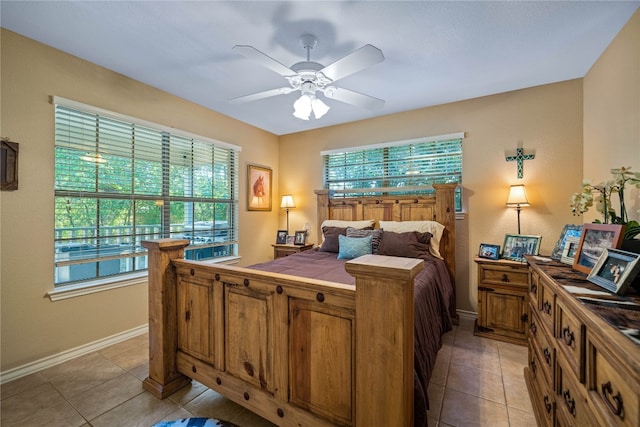 tiled bedroom with ceiling fan