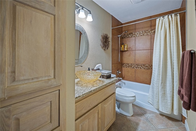 full bathroom with vanity, shower / bath combo, toilet, and tile patterned flooring