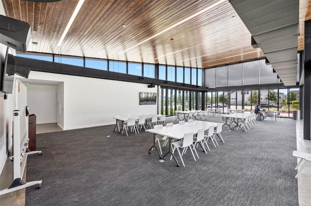 dining space with wood ceiling and carpet