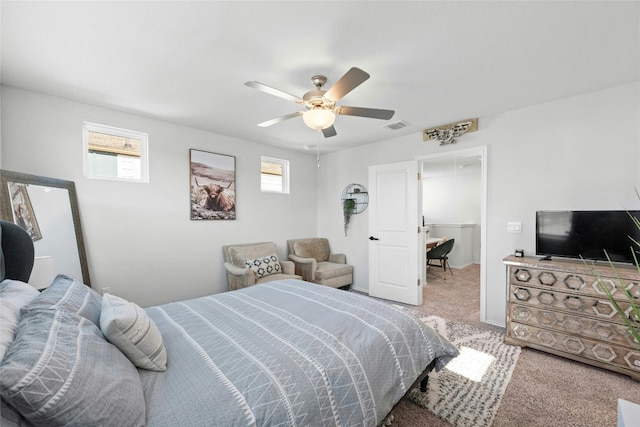 carpeted bedroom with a closet and ceiling fan