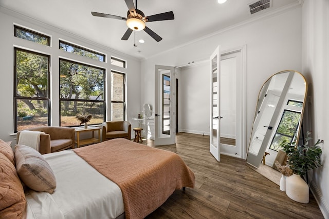 bedroom featuring french doors, ceiling fan, multiple windows, and dark hardwood / wood-style flooring