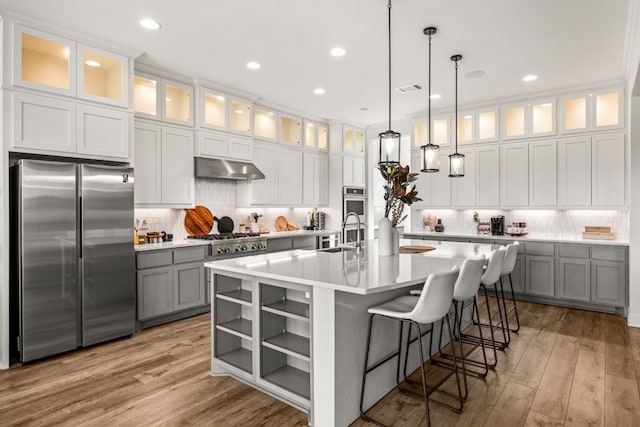 kitchen featuring gray cabinetry, stainless steel appliances, and white cabinetry