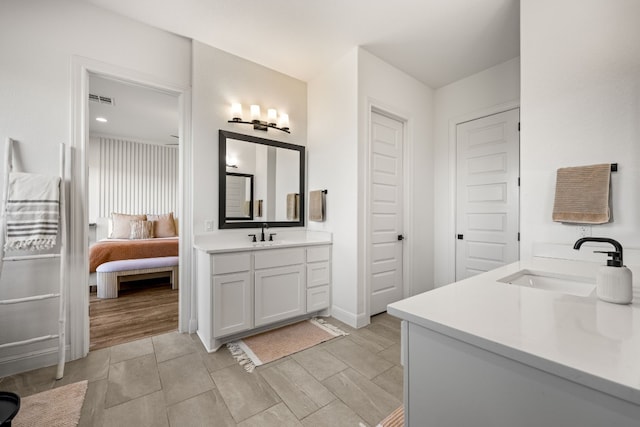 bathroom with vanity and hardwood / wood-style flooring