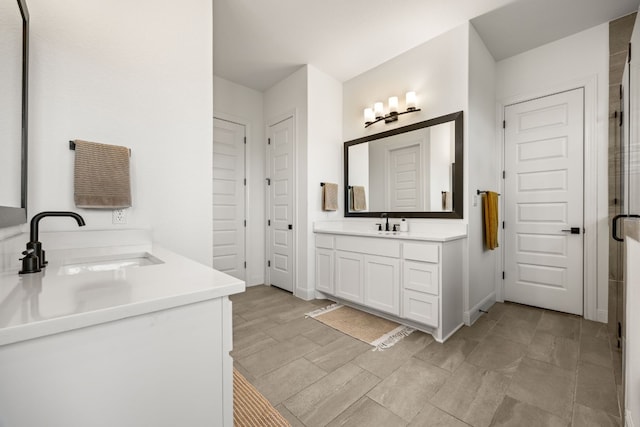 bathroom with vanity and a shower with shower door