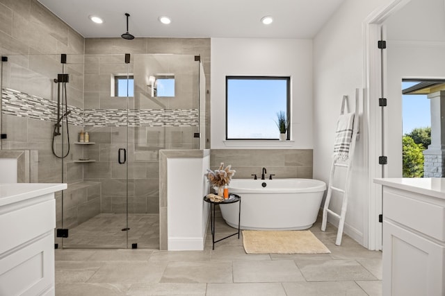 bathroom with vanity, plus walk in shower, and tile patterned floors