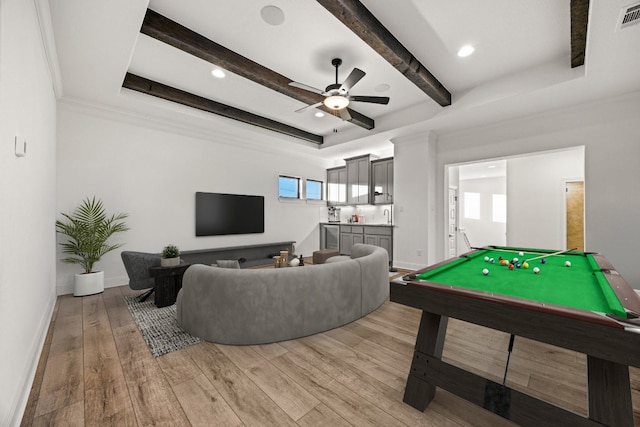 recreation room with pool table, beamed ceiling, hardwood / wood-style floors, crown molding, and ceiling fan