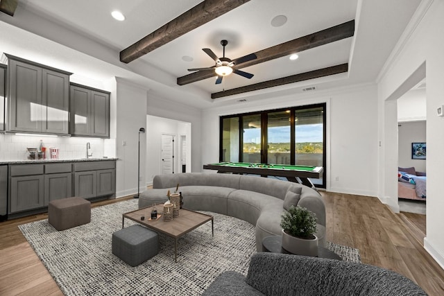 living room featuring crown molding, wet bar, pool table, and hardwood / wood-style flooring