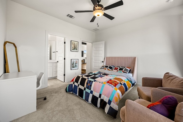 carpeted bedroom featuring ensuite bath and ceiling fan