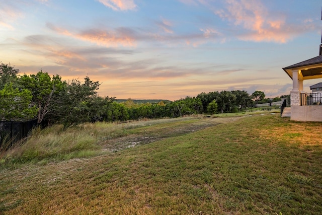 view of yard at dusk