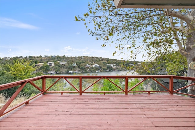 wooden deck featuring a water view