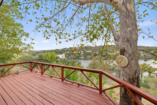 wooden deck with a water view