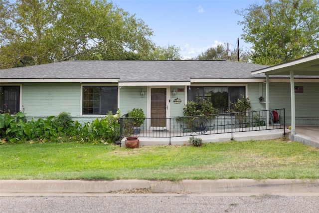 502 E Ave, Marble Falls, TX 78654 - single story home featuring a front lawn, roof with shingles, and a porch