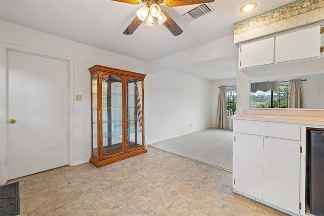 502 E Ave, Marble Falls, TX 78654 - unfurnished dining area with a ceiling fan and baseboards
