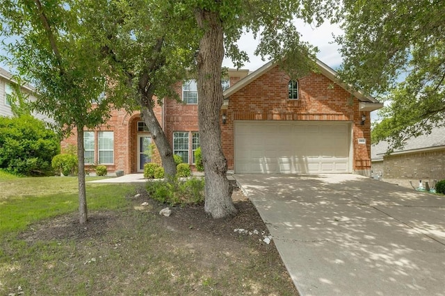 view of front of house with a garage and a front lawn