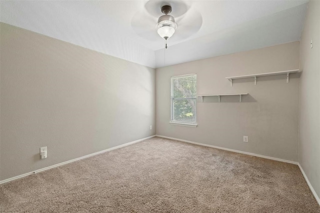 spare room featuring carpet flooring and ceiling fan