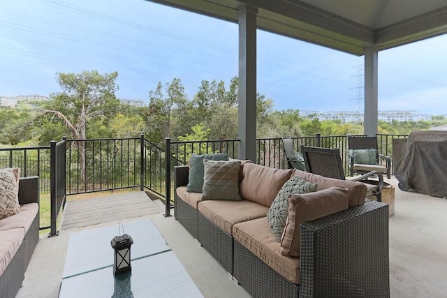 view of patio / terrace with an outdoor living space and a grill