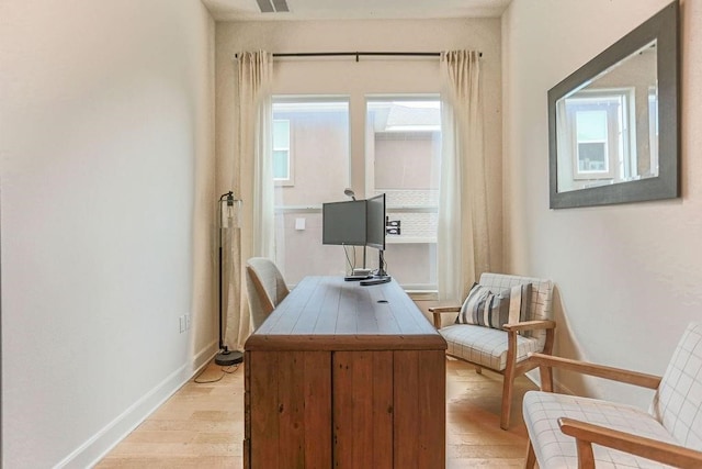 office with light hardwood / wood-style flooring