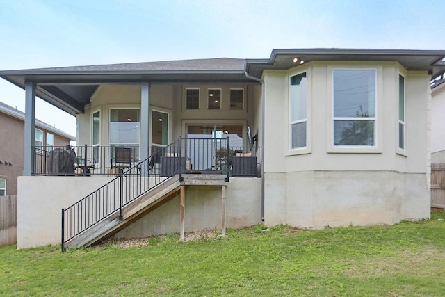 rear view of house with a lawn