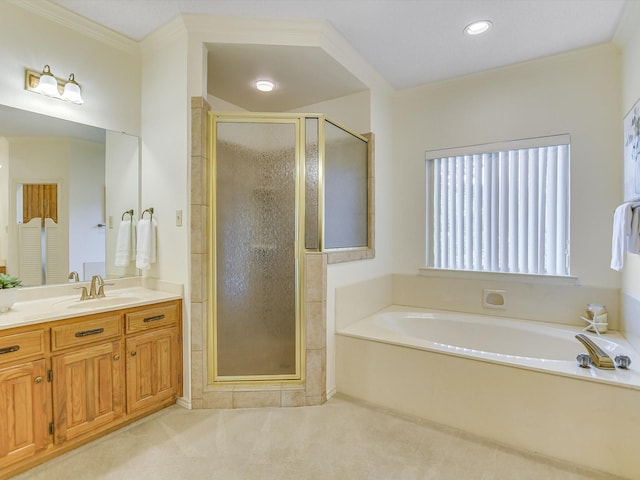 bathroom featuring plus walk in shower, vanity, and crown molding