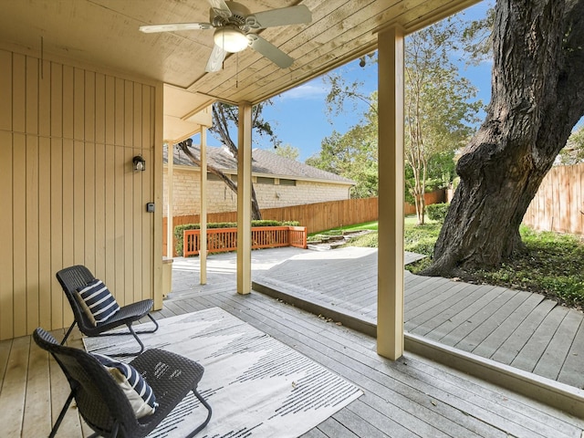 wooden deck featuring ceiling fan