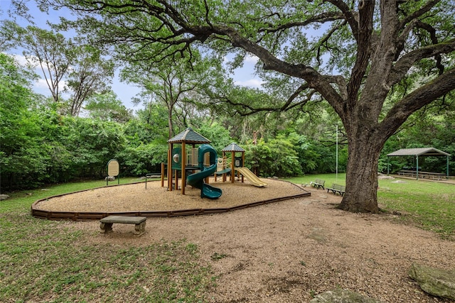 view of jungle gym with a lawn