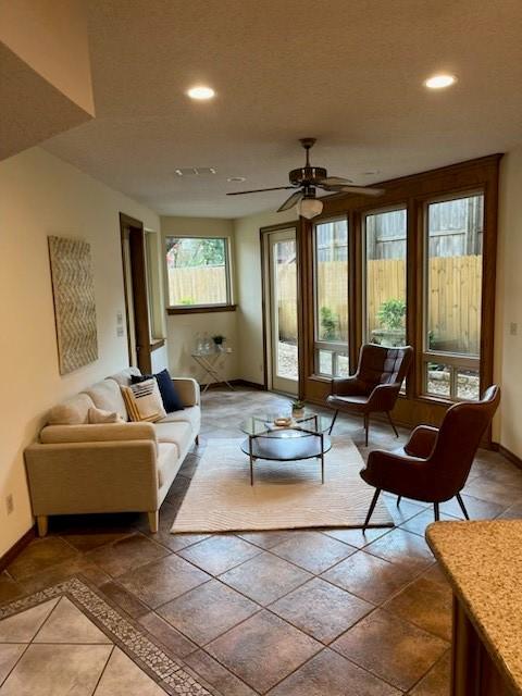 living room with ceiling fan