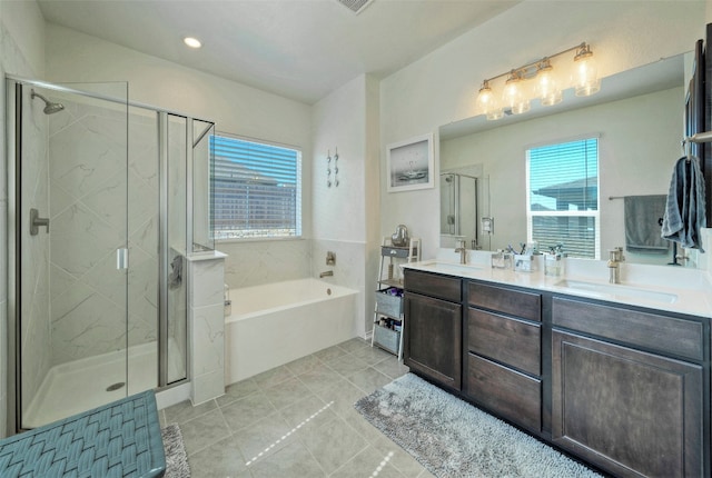 bathroom with vanity, independent shower and bath, and tile patterned floors