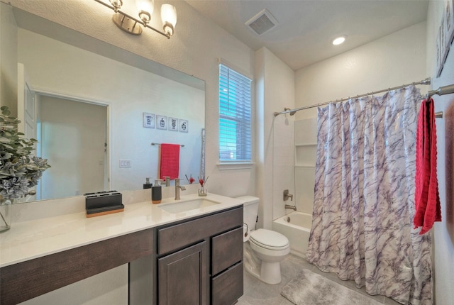 full bathroom with vanity, toilet, tile patterned floors, and shower / tub combo