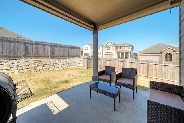 view of patio with a fenced backyard and a residential view