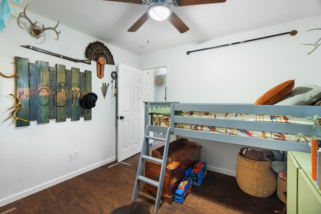 bedroom featuring ceiling fan and dark wood-type flooring