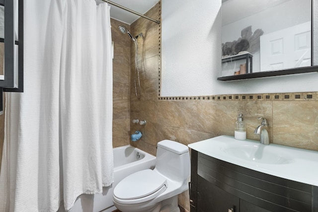 full bathroom with shower / bath combination with curtain, toilet, tile walls, and vanity