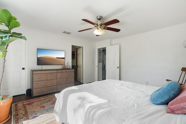 bedroom featuring ceiling fan and dark hardwood / wood-style floors