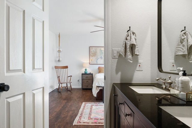 bathroom featuring hardwood / wood-style flooring, vanity, and ceiling fan