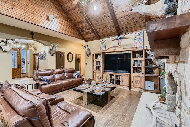 living room featuring wood ceiling, beam ceiling, high vaulted ceiling, wood-type flooring, and ceiling fan with notable chandelier