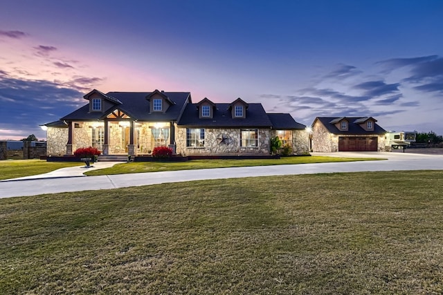 french provincial home featuring a yard