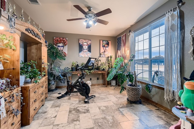 interior space featuring a water view and ceiling fan