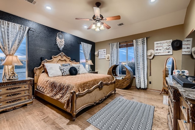 bedroom featuring ceiling fan and hardwood / wood-style flooring