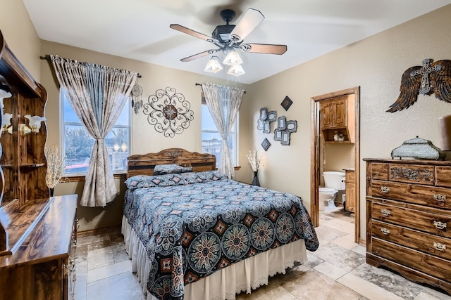 bedroom featuring ensuite bath and ceiling fan