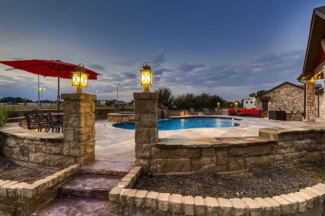 view of swimming pool featuring a patio, a hot tub, and pool water feature