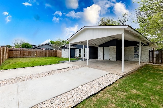 exterior space with a patio and a lawn