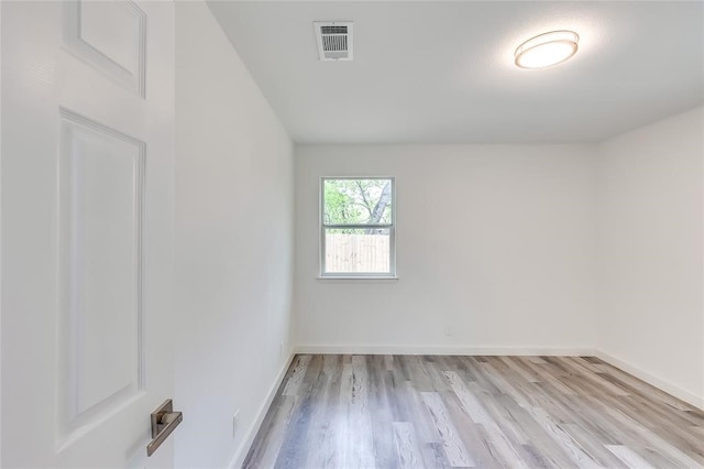 spare room with light hardwood / wood-style floors