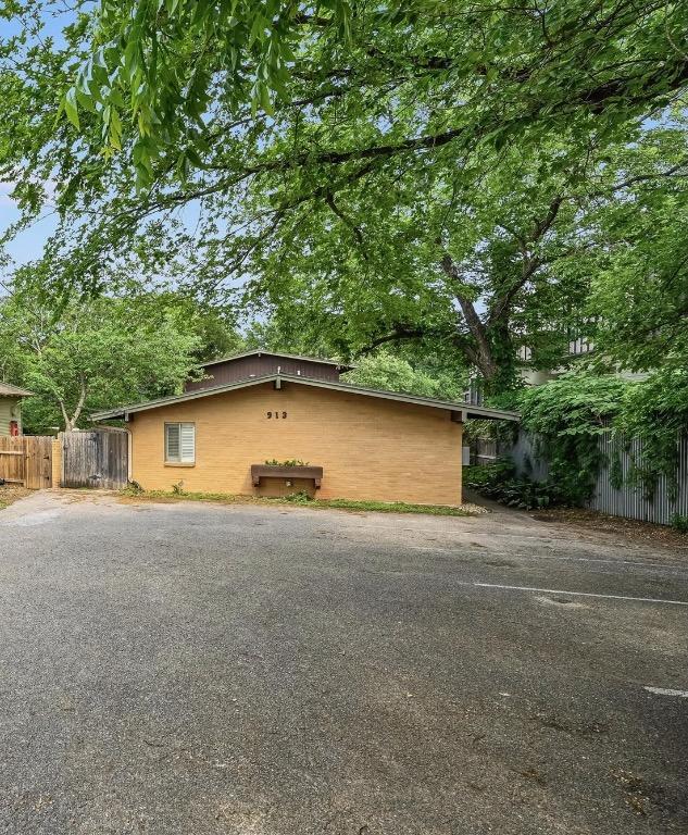 view of home's exterior with fence