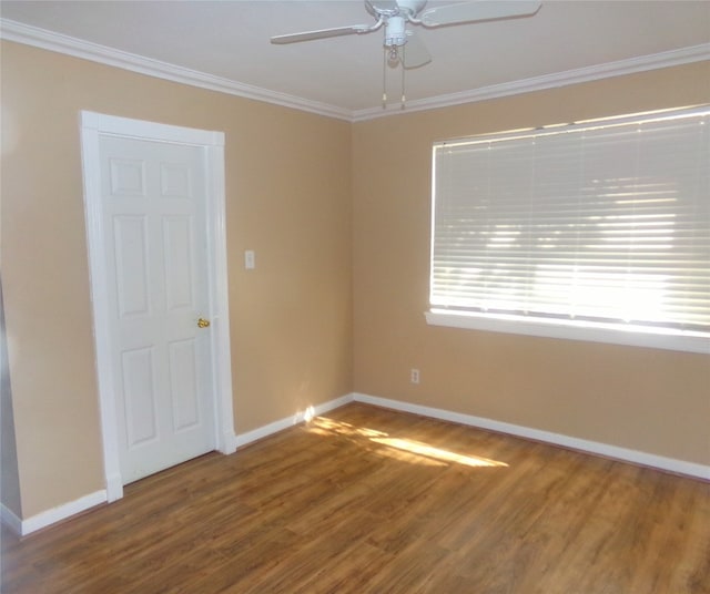 spare room featuring crown molding, hardwood / wood-style flooring, and ceiling fan