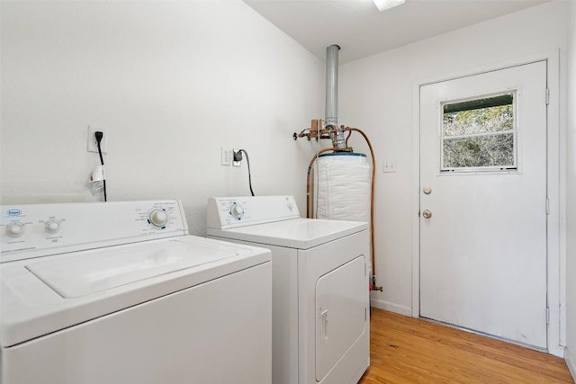 1401 Pursley Rd, Dripping Springs, TX 78620 - washroom with washer and clothes dryer, light wood-type flooring, laundry area, and baseboards