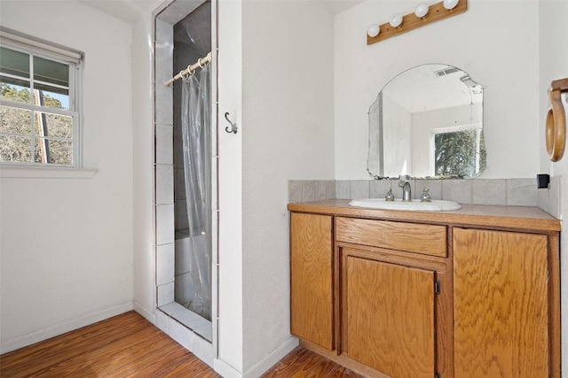 1401 Pursley Rd, Dripping Springs, TX 78620 - bathroom with wood finished floors, vanity, a shower with curtain, and baseboards