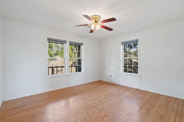 1401 Pursley Rd, Dripping Springs, TX 78620 - empty room featuring wood finished floors, ceiling fan, and baseboards
