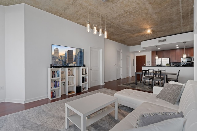 living room with dark hardwood / wood-style flooring